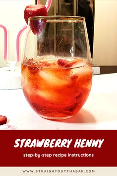 a glass filled with liquid sitting on top of a table next to strawberries and ice