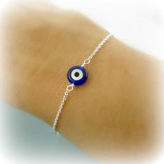 as seen on many this evil eye bracelet I've heard is supposed to bring good luck.... details: Sterling Silver .925 glass evil eye measures 8mm Dainty Chain measures 1mm please select your desired length from top right drop down menu thanks for looking :0) Blue Symbolic Nickel-free Jewelry, Symbolic Blue Nickel-free Jewelry, Blue Evil Eye Charm Bracelet As Gift, Blue Evil Eye Bracelets, Adjustable Blue Symbolic Bracelet, Blue Evil Eye Bracelet Gift, Symbolic Blue Bracelet Jewelry, Blue Sterling Silver Bracelets, Blue Sterling Silver Bracelet As Gift