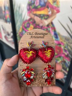 Beautiful and unique handmade earrings hand embroidered by Mexican artisans. We complement with gold-plated fashion jewelry. San Antonino hand embroidered earrings. Each style is unique and takes up to a week for artisans to complete and create. Beautiful unique style for any occasion. Embroidered Earrings, Mexican Earrings, Unique Handmade Earrings, Mexican Crafts, Traditional Mexican, Embroidered Heart, Heart Earrings, Handmade Earrings, Fashion Earrings