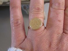 #jewelry #rings #solitairerings #goldring #coinring #statementring #vintagering #vintagejewelry #coin #coinjewelry #ringcoin #eldortina #framedcoinring #signetring #roundsignetring Vintage Coin Signet Ring As Gift, Vintage Coin Shaped Signet Ring Gift, Vintage Coin Signet Ring For Gift, 14k Gold Coin Shaped Anniversary Rings, Gold Coin-shaped Ring For Anniversary, Gold Coin-shaped Anniversary Ring, Hallmarked Coin Shaped Signet Ring As Gift, Gold Coin-shaped Signet Ring For Gift, Gold Coin Shaped Signet Ring