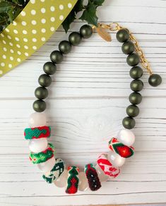 Holiday Adjustable Beaded Jewelry, Festive Adjustable Hand-strung Necklaces, Festive Hand-strung Adjustable Necklace, Bohemian Beaded Jewelry For Holidays, Bohemian Beaded Holiday Jewelry, Holiday Bohemian Beaded Jewelry, Bohemian Christmas Jewelry With Beads, Festive Green Beaded Bracelets With Colorful Beads, Festive Green Beaded Bracelets