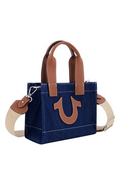 Contrast topstitching and the iconic winged logo bring a familiar finish to a squared denim tote bag topped with a trio of handles for convenient carrying. 8" H x 7" W x 4" D 5" handle drop, 25" strap drop Dual top handles, optional crossbody strap Textile and synthetic Lined Imported Casual Bags With Logo Hardware For Daily Use, Casual Bags For Daily Use With Logo Hardware, Casual Tote Bag With Logo Hardware, Rectangular Bags With Contrast Stitching For Everyday Use, Casual Rectangular Shoulder Bag With Logo Hardware, Rectangular Canvas Shoulder Bag With Logo Hardware, Casual Rectangular Bag With Logo Hardware, Casual Rectangular Bags With Logo Hardware, Casual Shopping Bags With Logo Hardware