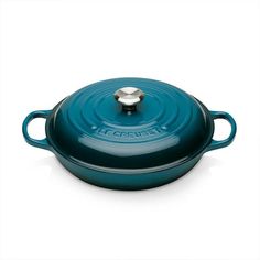 a blue cast iron casserole on a white background