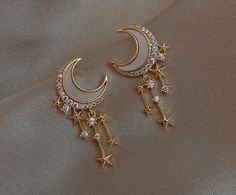 PRODUCT DETAILS *Gold plated *Sold as pair *Push back *Earlobe Ready to ship! Elegant Metal Earrings With Star Charm, Elegant Crystal Earrings With Moon Charm As Gift, Celestial Moon Earrings For Party, Star-shaped Moon Charm Earrings For Party, Party Earrings With Moon And Star Charms, Moon Charm Star Shaped Party Earrings, Celestial Moon-shaped Party Earrings, Moon-shaped Celestial Party Earrings, Celestial Moon Shape Party Earrings