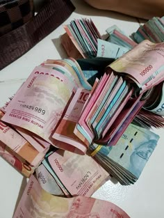 a pile of money sitting on top of a table