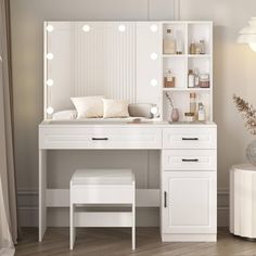 a white dressing table with lights on it