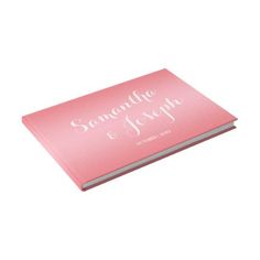 a pink personalized wedding book with the name and date on it