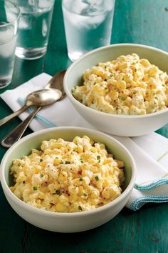 two white bowls filled with macaroni and cheese