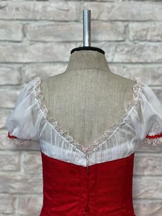 Professional, Russian style, La Fille Mal Gardee Romantic tutu. Deep red jaquard fitted bodice with front laced pattern and white pleated undershirt. Round neck with lace decorations and short chiffon white sleeves with red trims and white lace. V shaped back and closure with hooks and eyes. The front of the bodice is decorated with flower appliques and sparkles. The Romantic tutu skirt has been hand dyed and features gradient shades of red, fading to white. A high level professional tutu, suita White Lace Bodice With Lace Trim, Formal White Fitted Bodice, Vintage White Fitted Bodice, Lace Decorations, Romantic Tutu, Ballet Competition, White Sleeves, Russian Style, Lace Decor