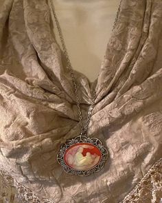 "JUST LISTED - Vintage Inspired - Mother Child ivory Red Orange Cameo Silver Pendant Necklace Family jewelry mom- JUST STUNNING necklace Substantial in size at just a little over 2 INCHES Long Center is 40mmx30mm Antique Silver Chain necklace is perfect at 24\" chain Nickel and Lead Compliant Center stone is 40x30mm- a STUNNING seemingly carved 3D recessed - HOW ADORABLE IS THIS ONE...- **PLEASE NOTE THIS LISTING IS FOR THE NECKLACE ONLY **thank you for taking the time to look at our items. Each Elegant Red Necklaces For Mother's Day, Elegant Red Necklace For Mother's Day, Red Cameo Necklace For Gift, Red Cameo Jewelry For Wedding, Red Cameo Jewelry Gift, Red Round Pendant Jewelry For Mother's Day, Personalized Vintage Red Jewelry, White Vintage Jewelry For Mother's Day, Red Jewelry For Mother's Day Gift