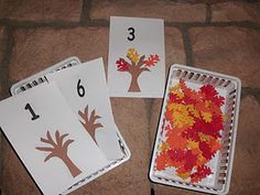 three matching cards with fall leaves on them, one is missing the number and the other has been cut out