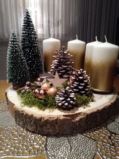 some pine cones and candles on a table