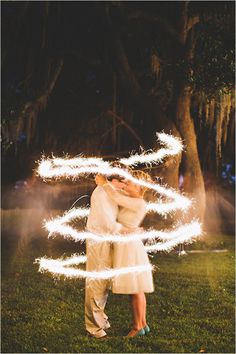 two different pictures with the same person kissing each other in front of trees and grass