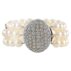 Indulge in the timeless elegance of our Estate Retro Era Three Row 7mm Akoya Pearl Bracelet. Each exquisite pearl is hand-selected for its perfect round shape and lustrous finish. The 14KT White Gold diamond clasp adds a touch of luxury with 5.95ct-tw G-VS round cuts, bringing a total of 47.89 grams of pure sophistication to your wrist. Vintage Beaded Bracelet, Gold Globe, Diamond Cuff Bracelet, Retro Bracelet, Retro Era, Tassel Bracelet, White Gold Bracelet, Akoya Pearls, Pearl Diamond