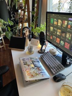 a computer monitor sitting on top of a white desk next to a keyboard and mouse