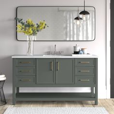 a bathroom vanity with two sinks and a large mirror