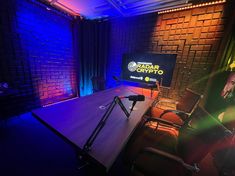 an empty conference room with chairs and a flat screen tv