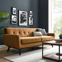 a living room scene with focus on the couch and coffee table in the foreground