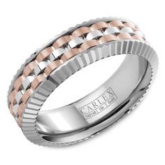 a white gold wedding band with an intricate design