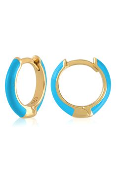 Easy-to-wear hoop earrings will add significant polish to even your most casual ensembles. 1/2" drop; 1/8" width Hinge with snap-post closure Sterling silver with goldtone plate/enamel Imported Blue Hypoallergenic Hoop Jewelry, Hypoallergenic Blue Hoop Jewelry, Blue Huggie Hoop Earrings, Blue Hypoallergenic Small Hoop Jewelry, Hypoallergenic Blue Small Hoop Jewelry, Adjustable Small Hoop Earrings In Blue, Adjustable Small Blue Hoop Earrings, Blue Huggie Hoop Earrings For Pierced Ears, Trendy Round Enamel Hoop Earrings