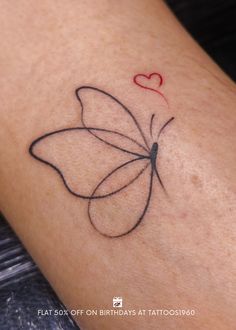 a small butterfly with a heart on it's back side tattooing its wings