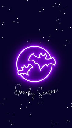 a purple neon sign that says spooky season in front of a night sky with stars