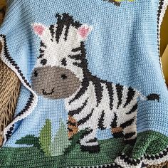 a crocheted blanket with a zebra on it