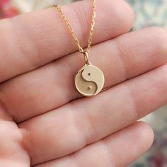 Our minimal tiny solid gold ying yang charm is just one of the many symbols represented in our Tiny Talismans line of spiritual jewelry and gifts. Available in 14k and 18k yellow rose and white gold, as well as platinum--just choose your desired metal from the drop-down menu!  More Tiny Talismans charm necklaces: http://etsy.me/2mtfeSO Details: - Made to order in NYC - Solid 14k, 18k gold or platinum - 11mm wide in diameter and 1.5mm thick. Contact us if you want bigger size. - Default finish is 14k Gold Spiritual Round Pendant Charm Necklace, Spiritual 14k Gold Charm Necklace With Round Pendant, Minimalist Personalized Jewelry For Meditation, Hypoallergenic Yellow Gold Spiritual Jewelry, Spiritual Round Charm Necklace In 14k Gold, 14k Gold Symbolic Charm Necklace With Round Pendant, Spiritual Round 14k Gold Charm Necklaces, Spiritual 14k Gold Round Charm Necklaces, Spiritual Round Charm Necklaces In Rose Gold