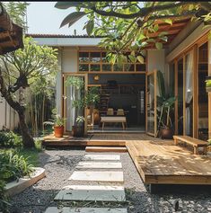 an outdoor living area with wooden steps and plants