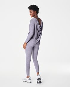 Our cozy, peachy-soft high-rise leggings feature a built-in waistband that gently smooths your curves with light core compression—plus an adjustable tunnel drawstring for the perfect fit. Made with super-soft fabric with 4-way stretch in a heathered, tonal design, these leggings are enhanced with strategically placed and engineered back-v-seaming that defines the booty. The result? A look that suits low-impact movement and just-as-easygoing outings.​ | Spanx Women's SPANXsmooth SoftStretch High-Rise Leggings Functional Stretch Leggings For Loungewear, Versatile Activewear For Fall, Sportswear Activewear With Thumbholes For Loungewear, High Stretch Go-dry Leggings For Loungewear, Functional Elastane Leggings For Loungewear, Fall High Stretch Loungewear Activewear, Functional Compression Loungewear Pants, Versatile Full-length Activewear For Loungewear, High Stretch Leggings For Loungewear