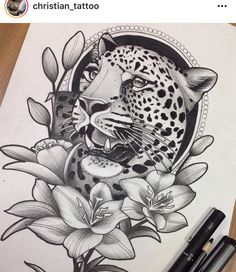 a black and white drawing of a leopard with flowers on it's chest, next to a marker pen