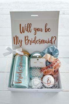 a white box filled with personalized items and the words will you be my bridesmaid?