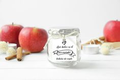 an apple sitting on top of a table next to some cinnamons and other items