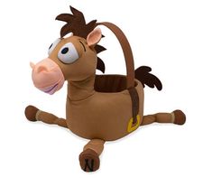 a stuffed toy horse carrying a basket on its back with it's nose open