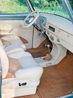 the interior of an old car is clean and ready to be used as a home