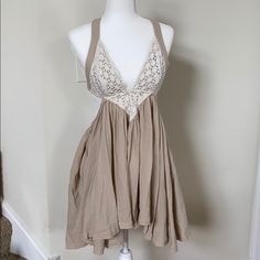 Tan Backless Free People Dress. Low V At Bust With Lace Overlay. Has Adjustable Ties On The Back For Bust And For The Skirt. Skirt Is Very Flowy For A Good Spin! Shells On The Ties. Nwot, Never Worn, No Damage. 4/15/20 Host Pick 7/20/21 Backless Beige Mini Dress For Spring, Beige Backless Mini Dress For Brunch, Beige Backless Mini Dress For Summer, Beige Backless Mini Dress For Spring, Beige Tie Back Mini Dress For Spring, Beige Backless Mini Dress For Day Out, Beige Lace Trim Sundress, Brown Backless Dress For Spring, Spring Brown Backless Dress