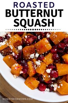 roasted butternut squash with cranberries and feta cheese in a white bowl