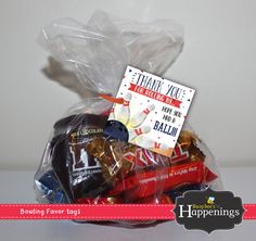 a bag filled with chocolates and candy bar wrapped in cellophane to say thank you