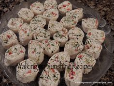 there are many small sandwiches on the glass platter with words walking sunshinene recipes