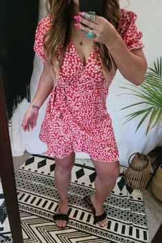 “Where you are is where I want to be”- Anonymous Be a total smokeshow this summer. Our stunning red floral sun mini dress is perfect for any date night or any sundee fundee. This adorable dress features swiss dot details, a deep-v cut neckline with a ruffled hem, short puff sleeves with a ruffled hem, side tie details, and is totally hot and perfect for a boheme babe like you. Style this dress with any of our Wide Brims to instantly elevate your style. Runs a little smaller in size, order 1 up! Fitted Red V-neck Wrap Dress, Flirty Summer Holiday Dresses, Red Surplice Neckline Dress For Date Night, Short Sleeve Mini Dress For Holiday, Red Flowy V-neck Dress, Red V-neck Dress For Day Out, Red V-neck Dress For Holiday, Red Surplice Neckline Summer Dress, Red V-neck Holiday Dress