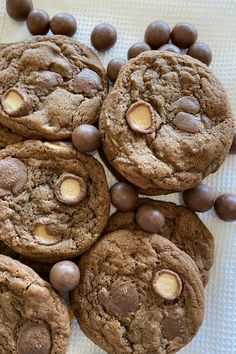 chocolate chip cookies and white chocolate chips on a table