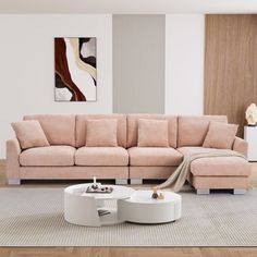 a living room with a sectional couch and coffee table