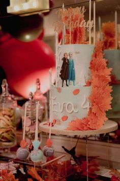 a birthday cake with two people on it