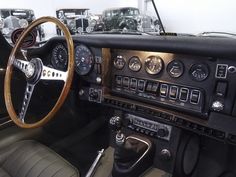 the interior of an old car with many gauges and dash boards on it's dashboard