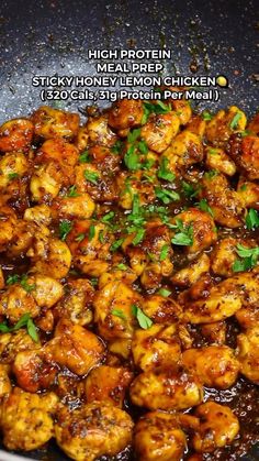 chicken is cooking in a pan with sauce and parsley on the side for garnish