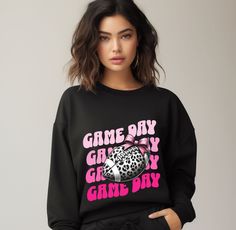 A pink coquette sweatshirt perfect for football season with a cute and funny design. This sweatshirt exudes a playful and fun vibe, making it a must-have for football fans looking to stay cozy and stylish during games. Ideal for both men and women, this sweatshirt is a great choice for fall and winter celebrations. Product features - Made with a cozy medium-heavy fabric blend of 50% cotton and 50% polyester - Ribbed knit collar ensures shape retention - Double-needle stitching for durability - Ethically made with 100% US cotton - OEKO-TEX-certified dyes with low environmental impact Care instructions - Machine wash: cold (max 30C or 90F) - Non-chlorine: bleach as needed - Tumble dry: low heat - Do not iron - Do not dryclean Game Day Football, Pink Coquette, Gifts For Sports Fans, Football Season, Game Day, Funny Design, Unisex Sweatshirt, Sweat Shirt, Ribbed Knit