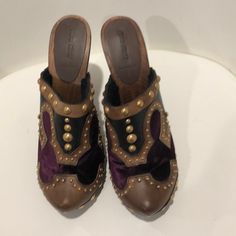 Purple Velvet, Brown And Tan Leather With Gold Studs, Never Worn 100%%% Authentic Luxury Brown Clogs With Round Toe, Luxury Brown Closed Toe Clogs, Brown Slip-on Mules With Studded Rubber Outsoles, Brown Slip-on Mules With Studded Outsoles, Brown Closed Toe Mules With Studded Rubber Outsoles, Designer Mules With Wooden Heel And Round Toe, Studded Clogs, Miu Miu Shoes, Purple Velvet