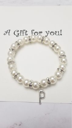 This beautiful pearl personalize bracelet is the perfect gift for someone special! Please leave a note at checkout which initial you would like on the bracelet. Thanks for visiting Bracelet For Wedding, Flower Girl Jewelry, Flower Girl Bracelets, Girl Bracelet, Bracelet Flower, Personalized Wedding Gift, Bracelet Pearl, Gift Flower, Girl Jewelry