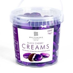 a bucket of black cherry creams on a white background