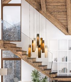 a living room filled with furniture next to a stair case